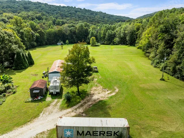 a view of a swimming pool with a yard