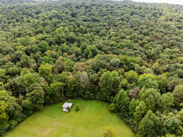 a aerial view of a golf course with chairs