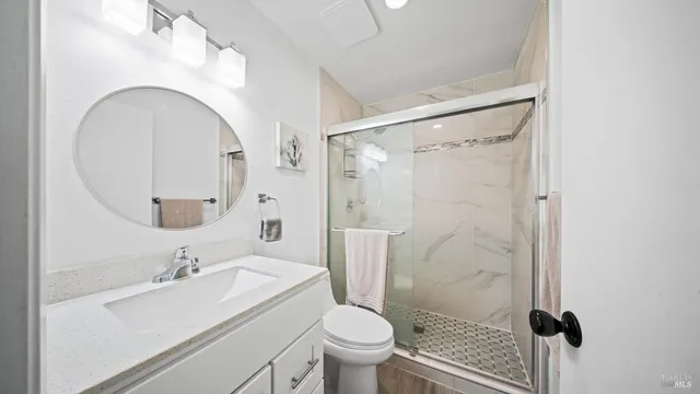 a bedroom with two beds and a dresser