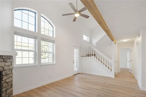 a view of an entryway with wooden floor