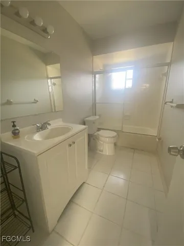 a kitchen with kitchen island a stove a refrigerator a sink dishwasher with a dining table and chairs