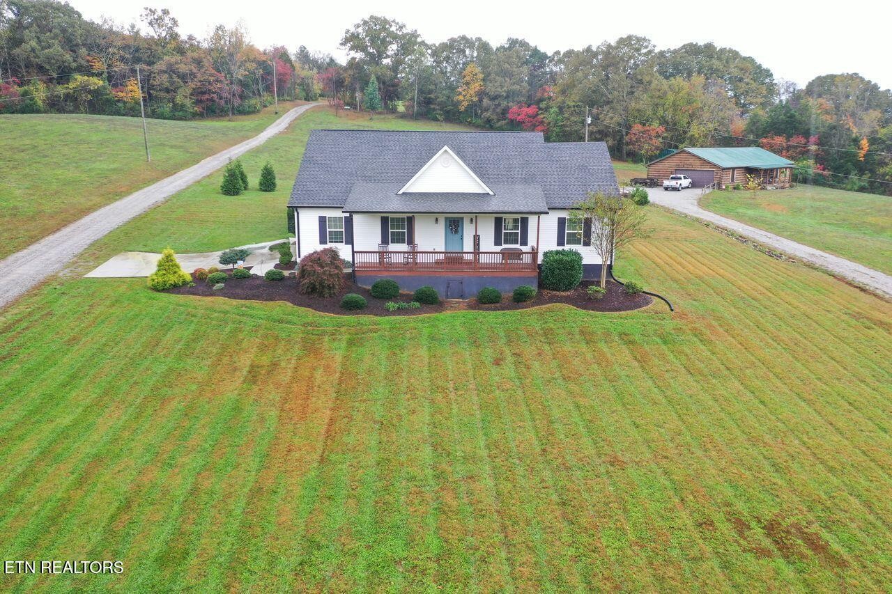 1825 Pleasant View Cemetery Road New Market, TN 37820 - Photo 1 of 19 a view of a big house with a big yard and large trees