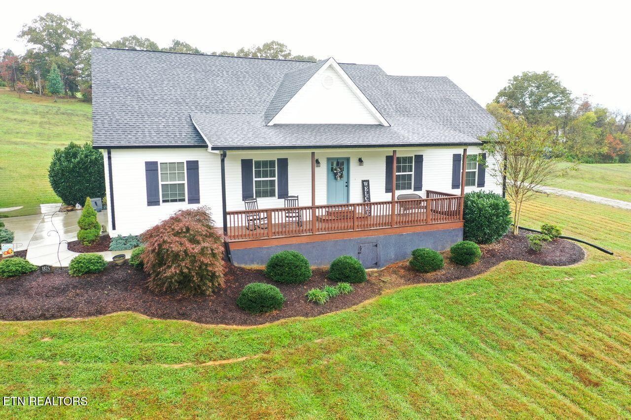 1825 Pleasant View Cemetery Road New Market, TN 37820 - Photo 17 of 19 a front view of a house with garden