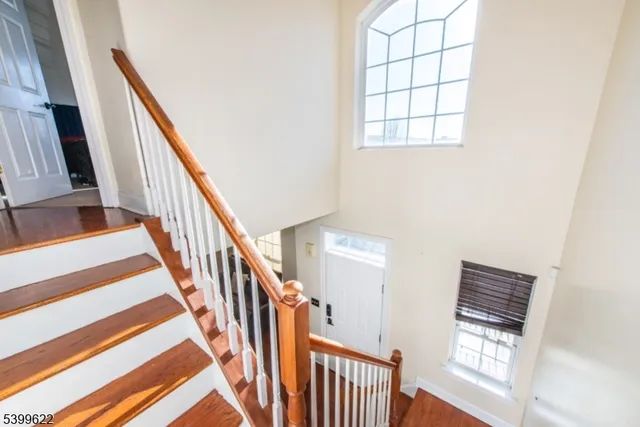 a view of staircase with wooden floor and staircase