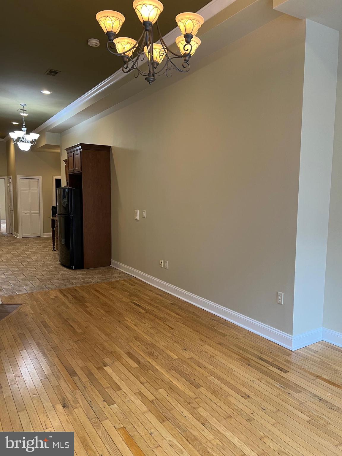 1230 North Calvert Street, Unit 1 Baltimore, MD 21202 - Photo 5 of 14 a view of a room with a chandelier