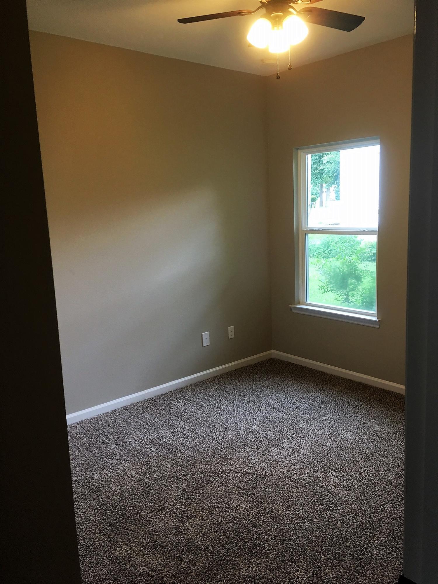 240 Dixie Street Crestview, FL 32536 - Photo 19 of 20 an empty room with a window