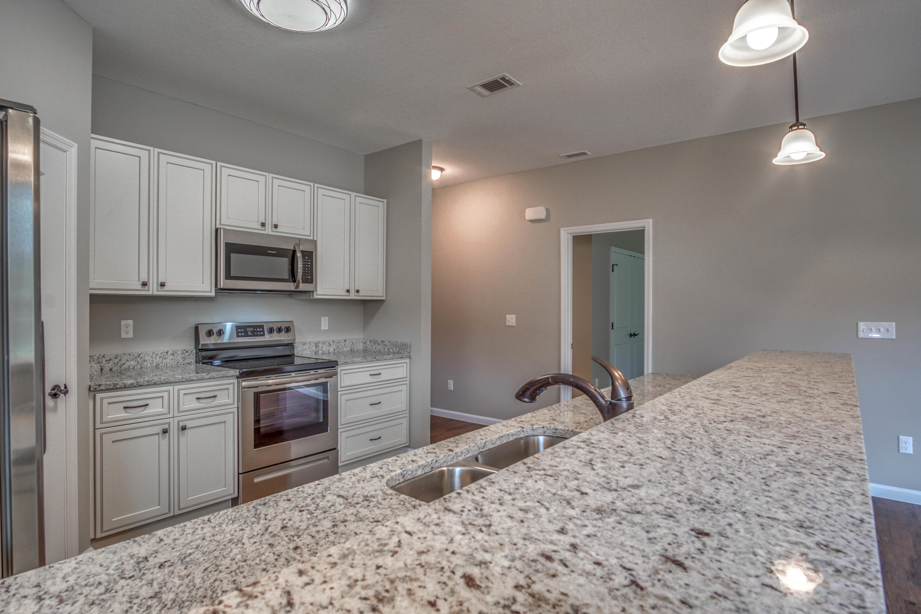 240 Dixie Street Crestview, FL 32536 - Photo 8 of 20 a kitchen with a sink appliances and cabinets