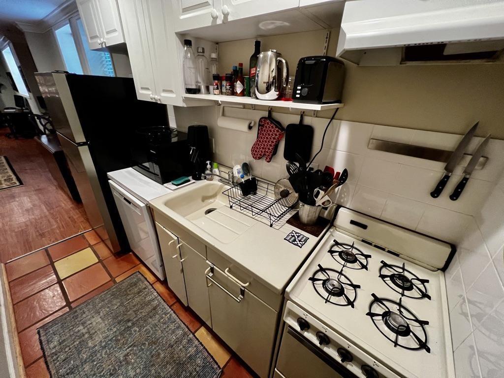 544 East Ponce De Leon Avenue, Unit TERRACE Decatur, GA 30030 - Photo 3 of 18 a room with storage and utility
