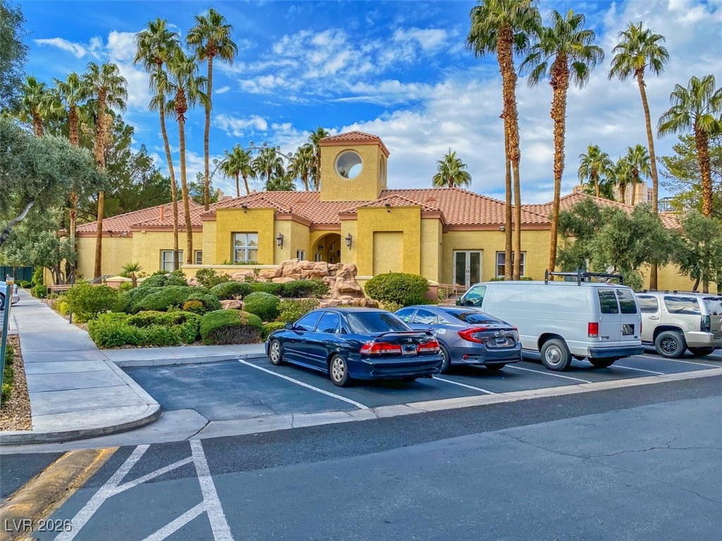 260 East Flamingo Road, Unit 229 Las Vegas, NV 89169 - Photo 13 of 41 View of building exterior featuring uncovered parking