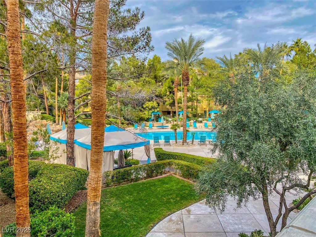 260 East Flamingo Road, Unit 229 Las Vegas, NV 89169 - Photo 16 of 41 Community pool featuring a patio and a yard
