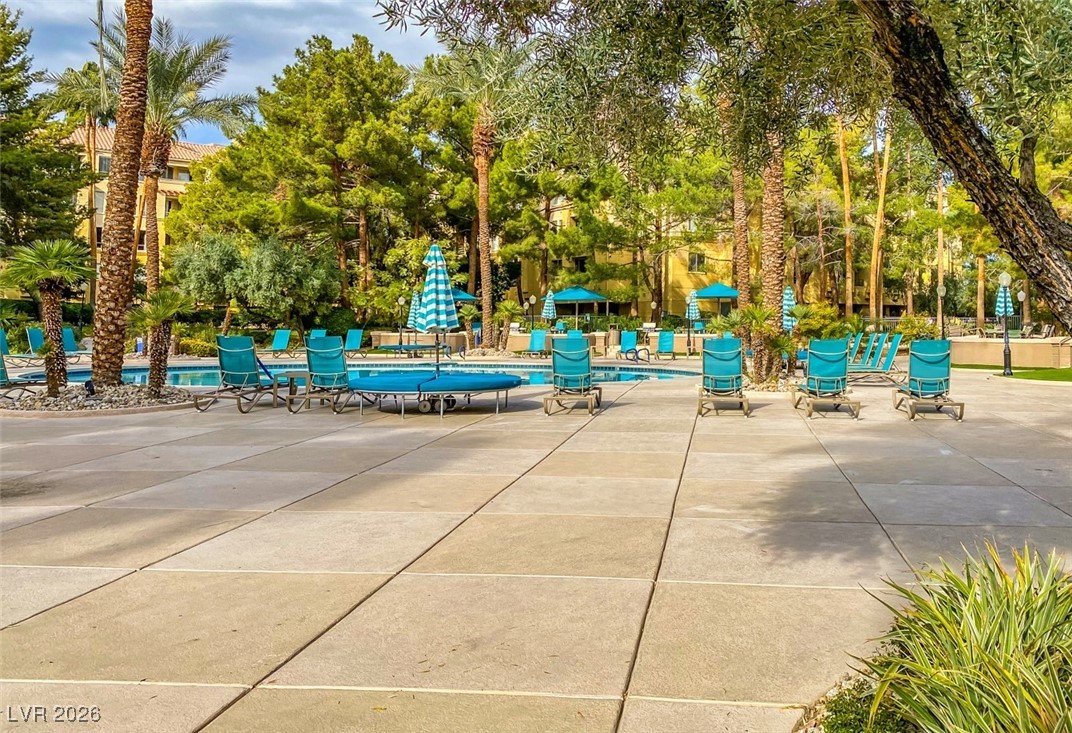 260 East Flamingo Road, Unit 229 Las Vegas, NV 89169 - Photo 17 of 41 View of property's community featuring a swimming pool and a patio