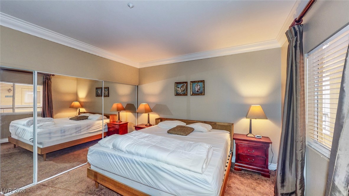 260 East Flamingo Road, Unit 229 Las Vegas, NV 89169 - Photo 20 of 41 Carpeted bedroom with ornamental molding and a closet