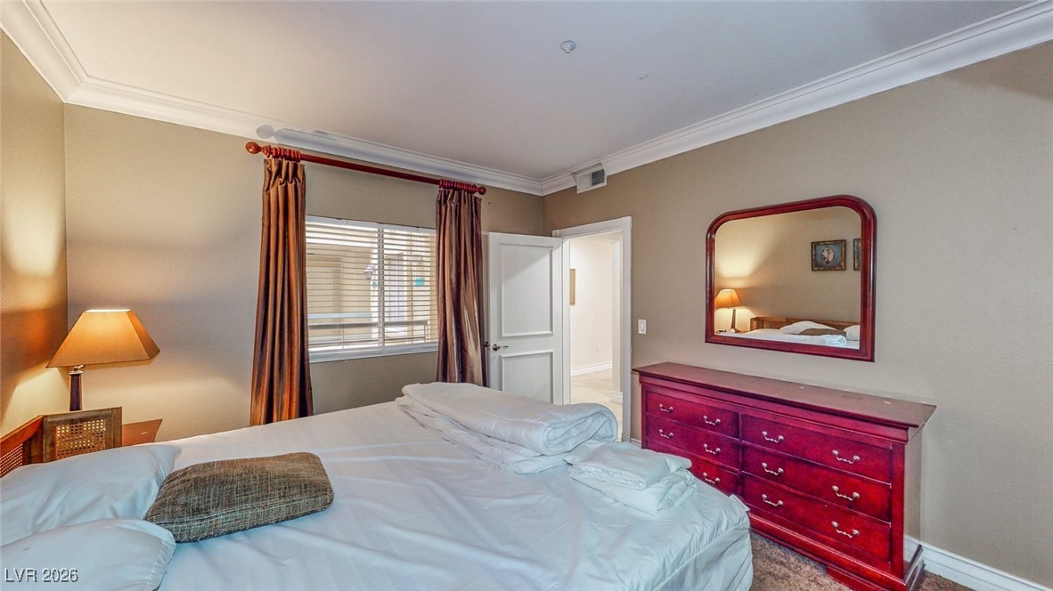 260 East Flamingo Road, Unit 229 Las Vegas, NV 89169 - Photo 22 of 41 Bedroom featuring crown molding and carpet floors