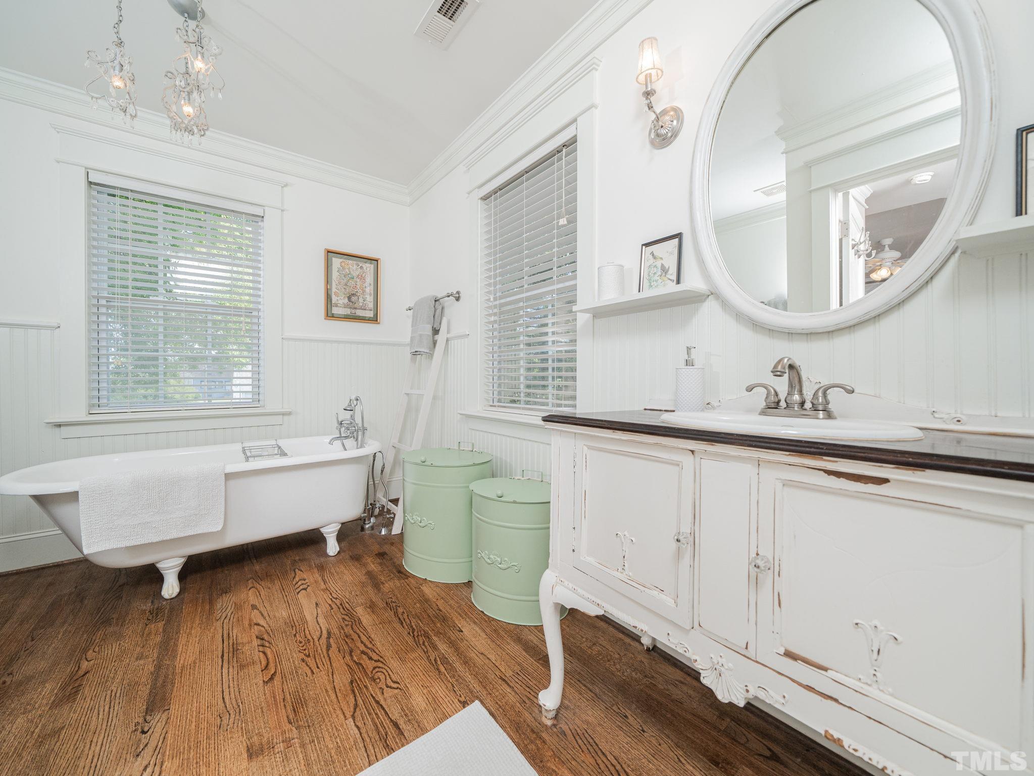 630 New Road Raleigh, NC 27608 - Photo 43 of 55 a bathroom with a sink and a mirror