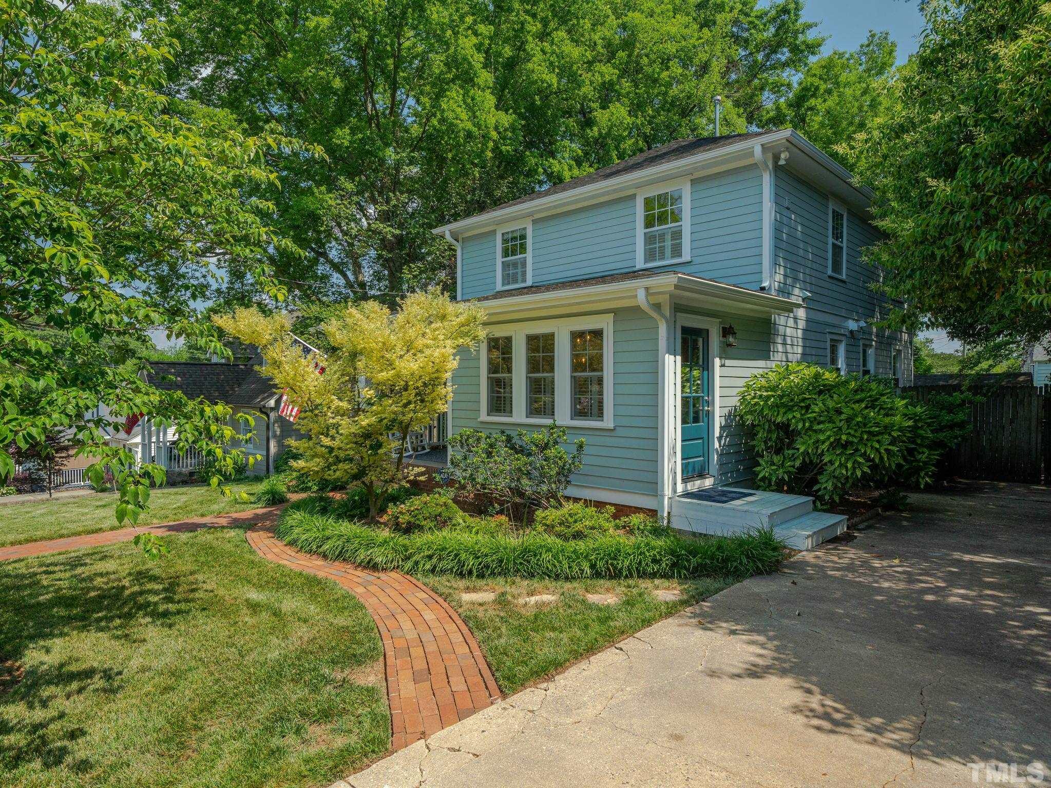630 New Road Raleigh, NC 27608 - Photo 8 of 55 a front view of a house with a yard