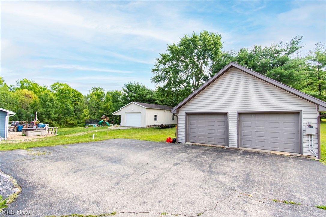 3281 South Turner Road Canfield, OH 44406 - Photo 25 of 33 Garage featuring a yard