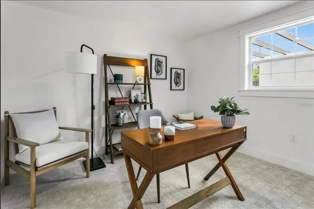 a view of a workspace with furniture