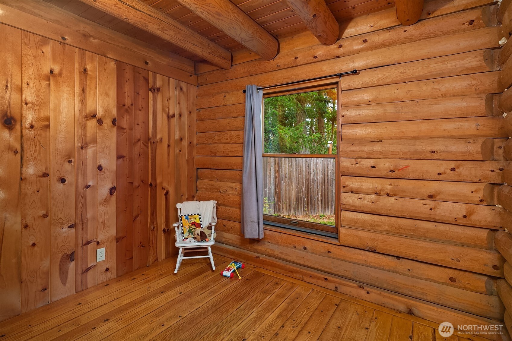 4 East Mountain View Road Camano Island, WA 98282 - Photo 17 of 26 a view of a room with a door and wooden walls