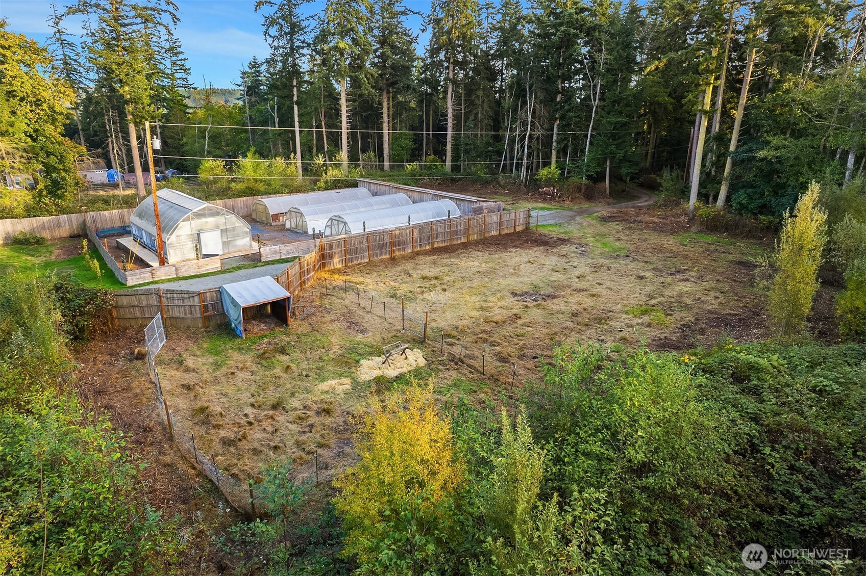 4 East Mountain View Road Camano Island, WA 98282 - Photo 26 of 26 a backyard of a house with fountain table and chairs