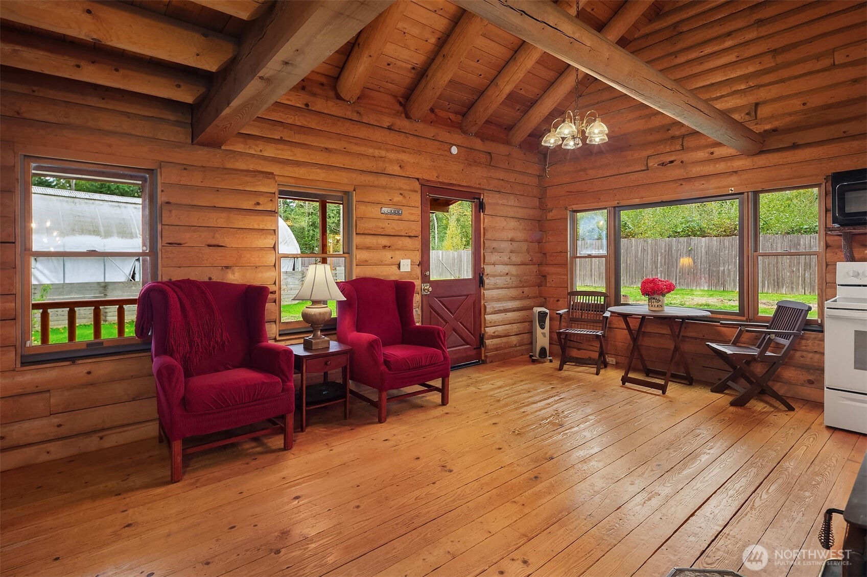 4 East Mountain View Road Camano Island, WA 98282 - Photo 6 of 26 a living room with furniture fireplace and a large window