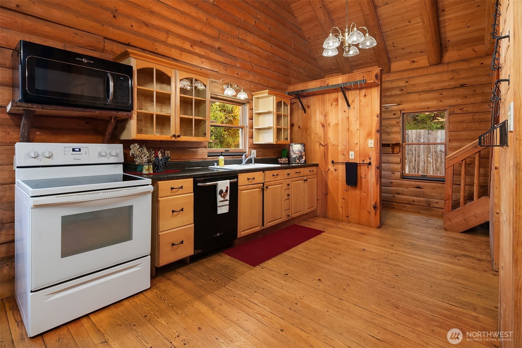 4 East Mountain View Road Camano Island, WA 98282 - Photo 10 of 26 a kitchen with stainless steel appliances granite countertop a stove and a microwave