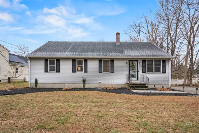 a front view of a house with a yard