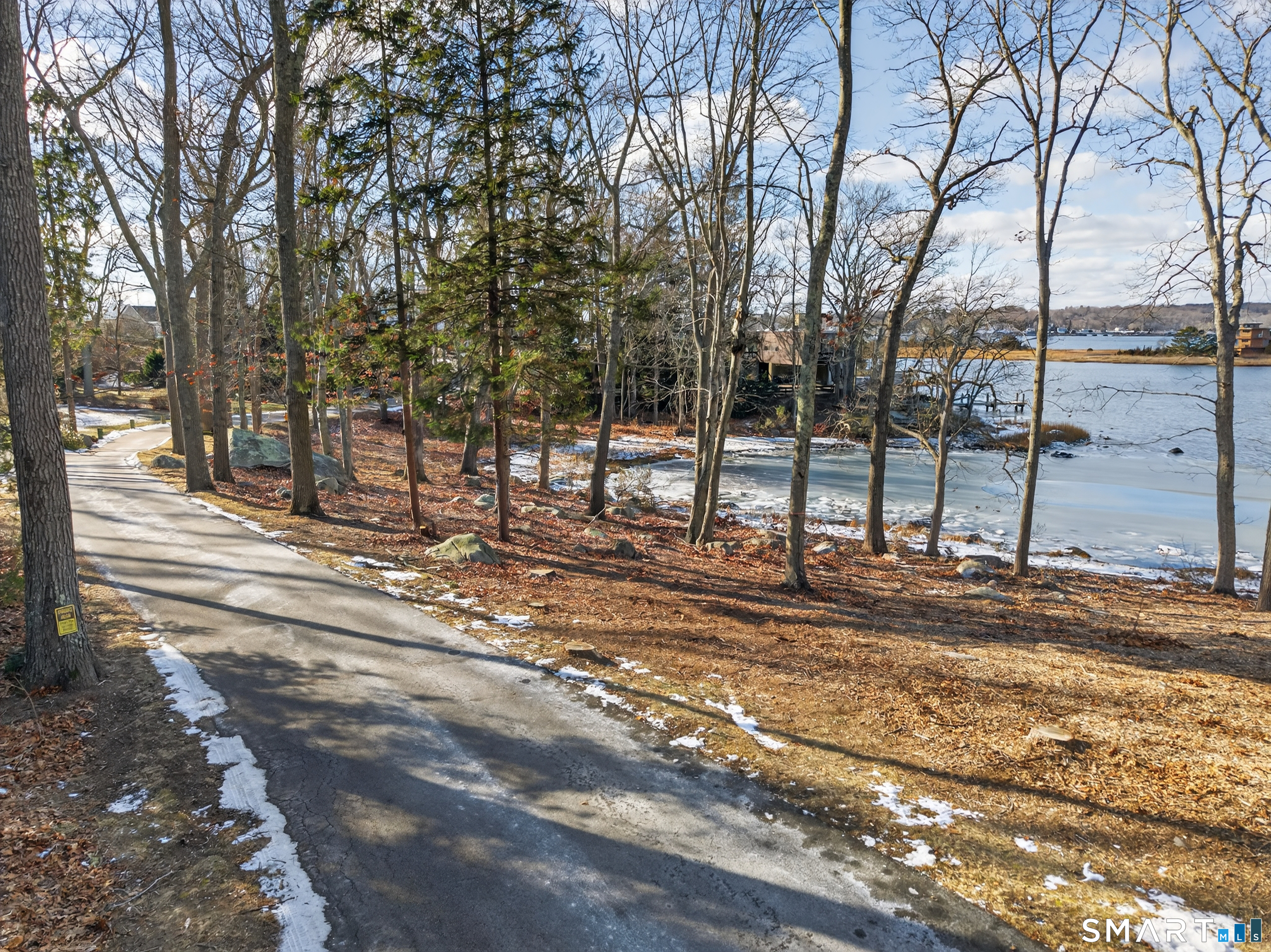 28 Money Point Road Stonington, CT 06355 - Photo 18 of 31 a view of a yard with trees in the background