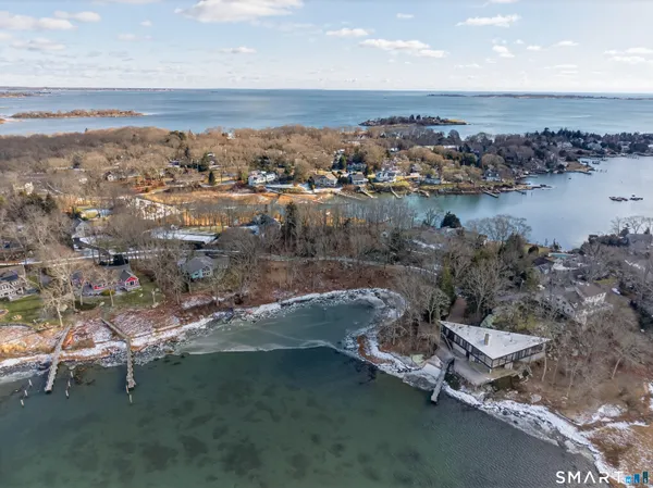 an aerial view of a house with a ocean view