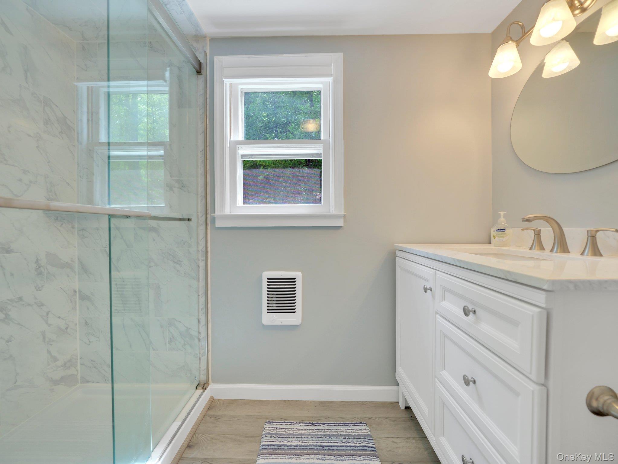 229 Eldred-Yulan Road Barryville, NY 12719 - Photo 15 of 34 a bathroom with a sink a vanity and a mirror