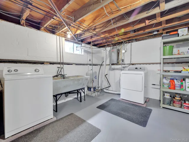 a view of storage and utility room with washer and dryer