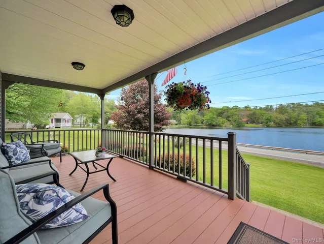 a view of a balcony with furniture