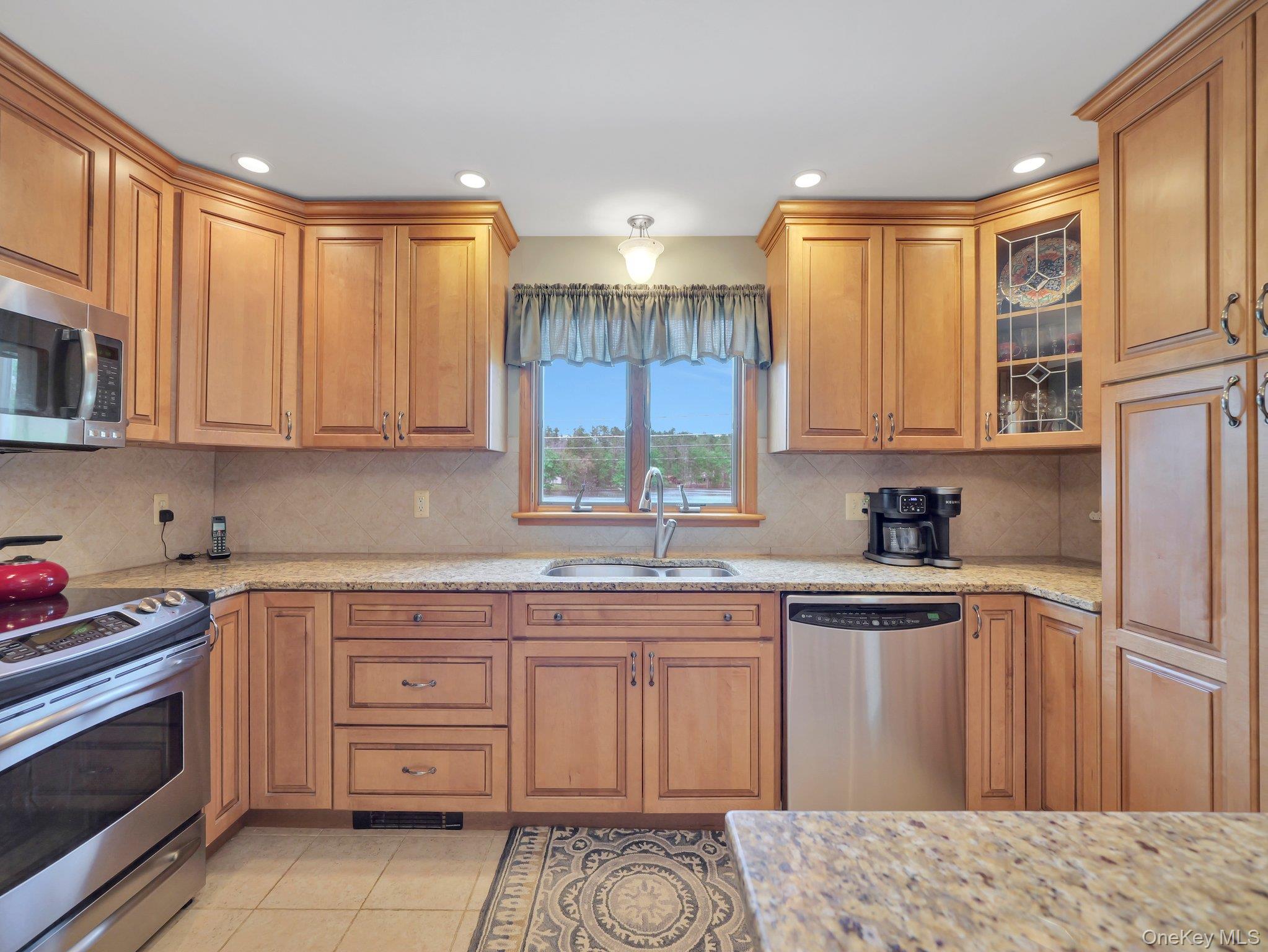229 Eldred-Yulan Road Barryville, NY 12719 - Photo 21 of 34 a kitchen with a sink stove and cabinets