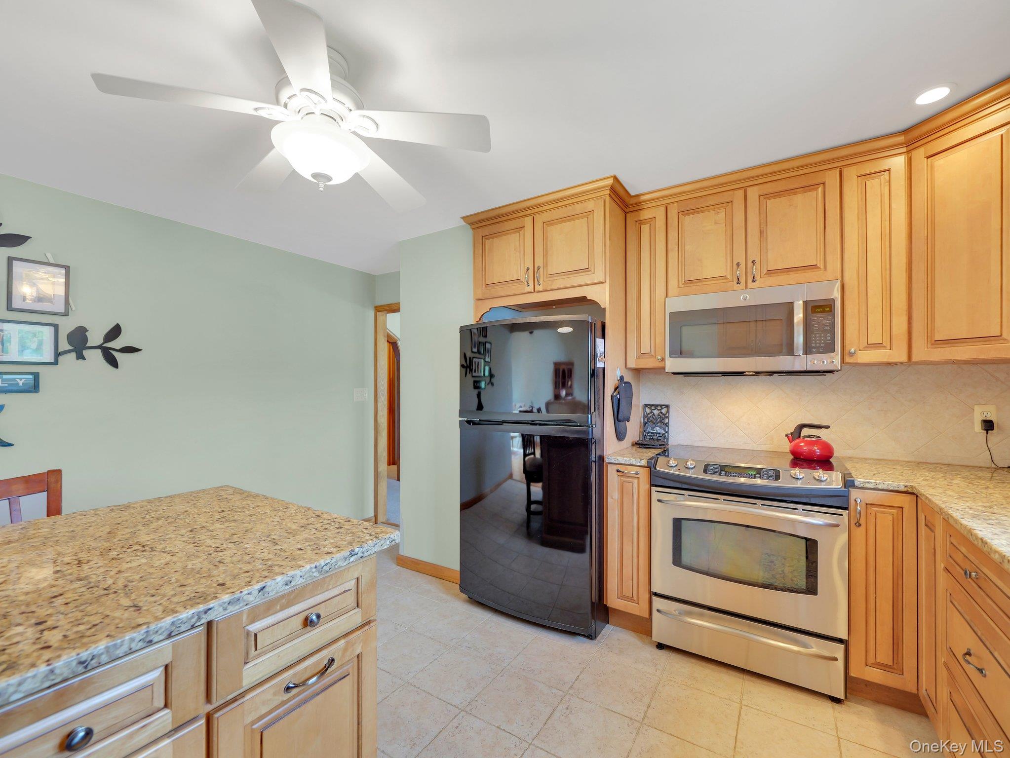 229 Eldred-Yulan Road Barryville, NY 12719 - Photo 23 of 34 a kitchen with a stove and a microwave