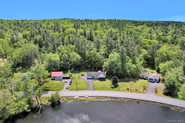 a couple of green field sitting in middle of a field