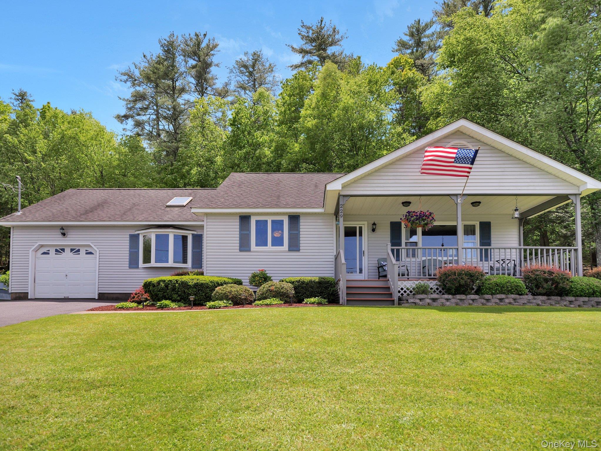 229 Eldred-Yulan Road Barryville, NY 12719 - Photo 3 of 34 a front view of a house with garden