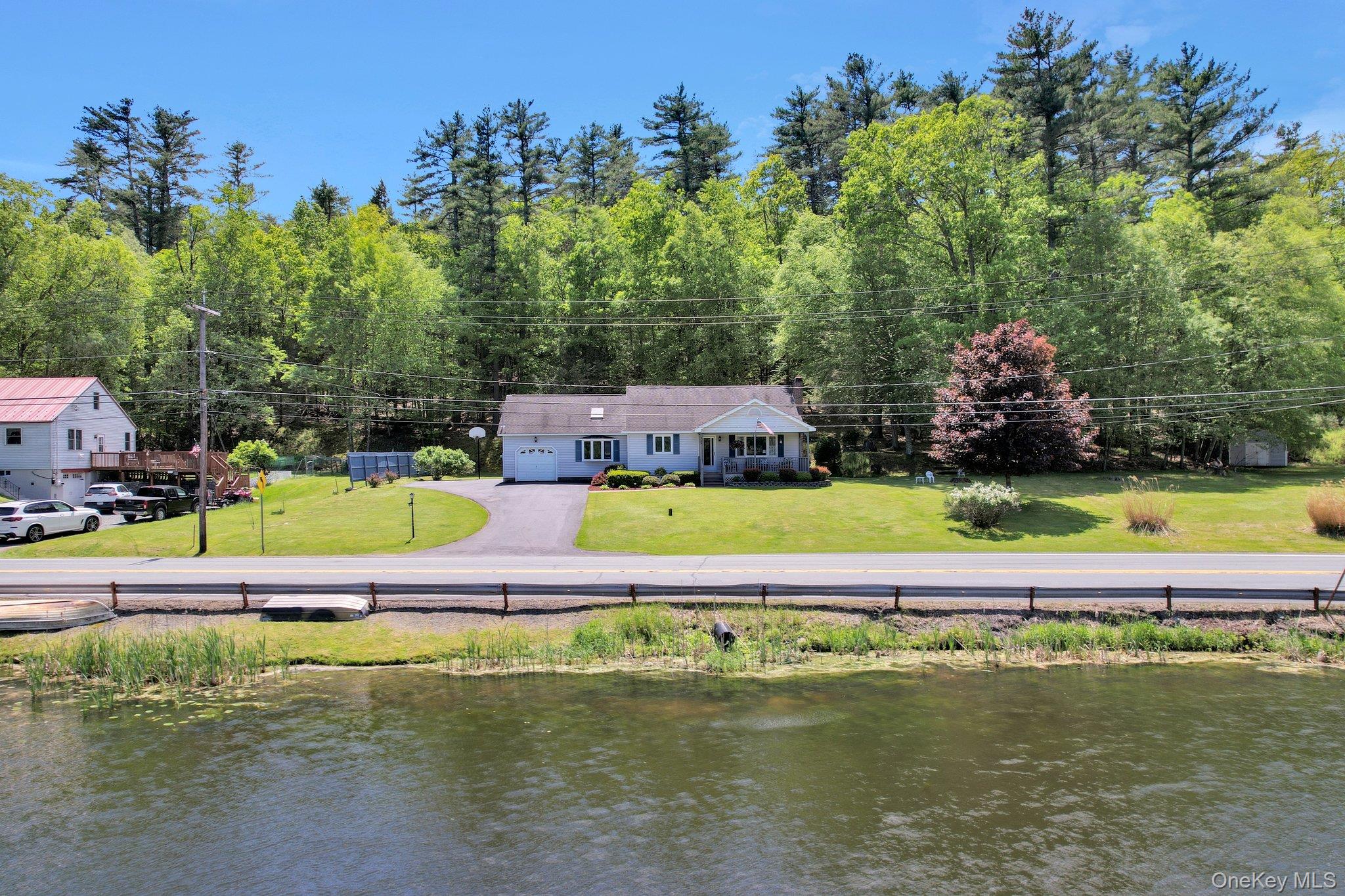 229 Eldred-Yulan Road Barryville, NY 12719 - Photo 31 of 34 a view of a swimming pool and trees in the background