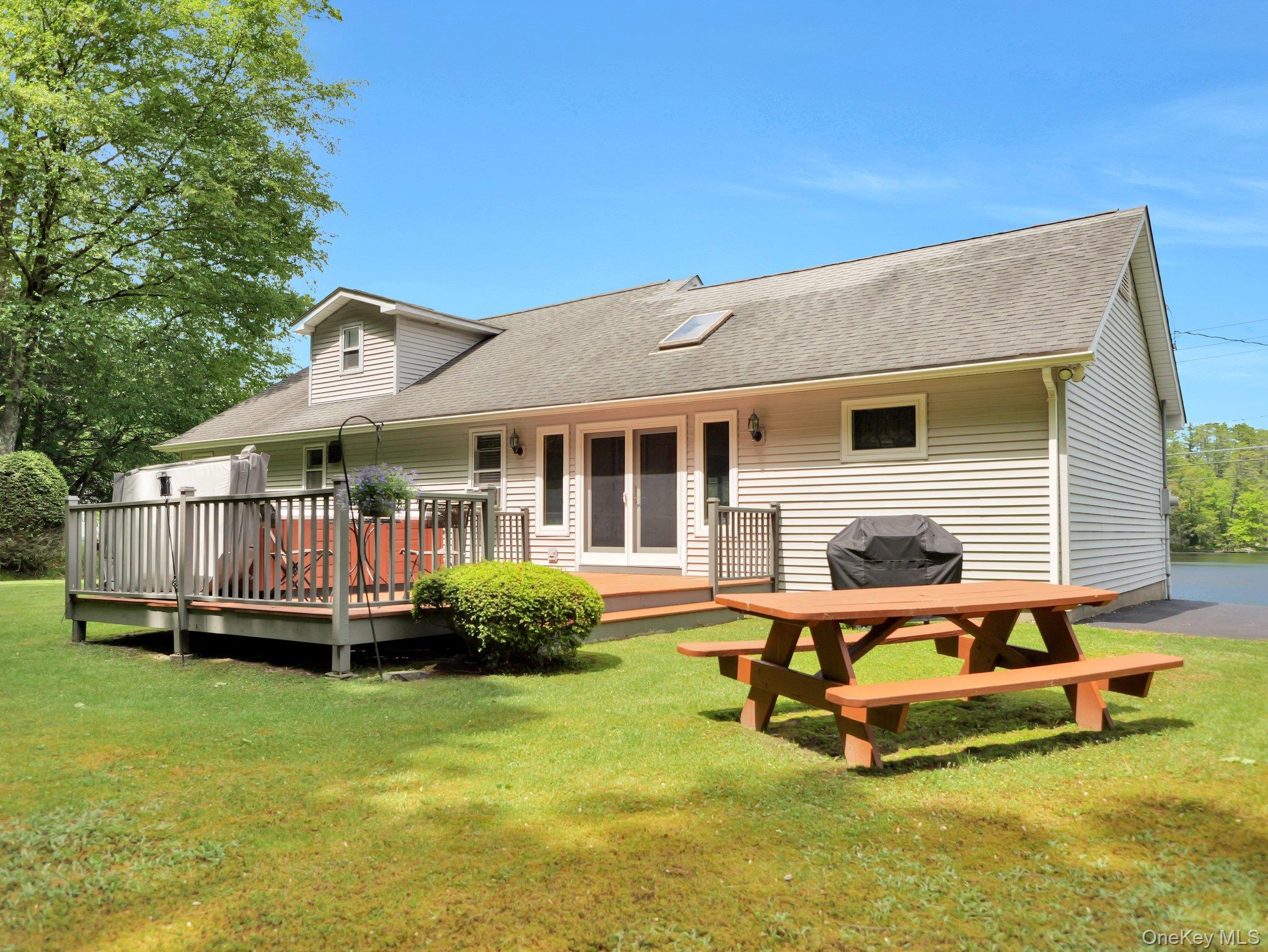 229 Eldred-Yulan Road Barryville, NY 12719 - Photo 34 of 34 a backyard of a house with yard table and chairs