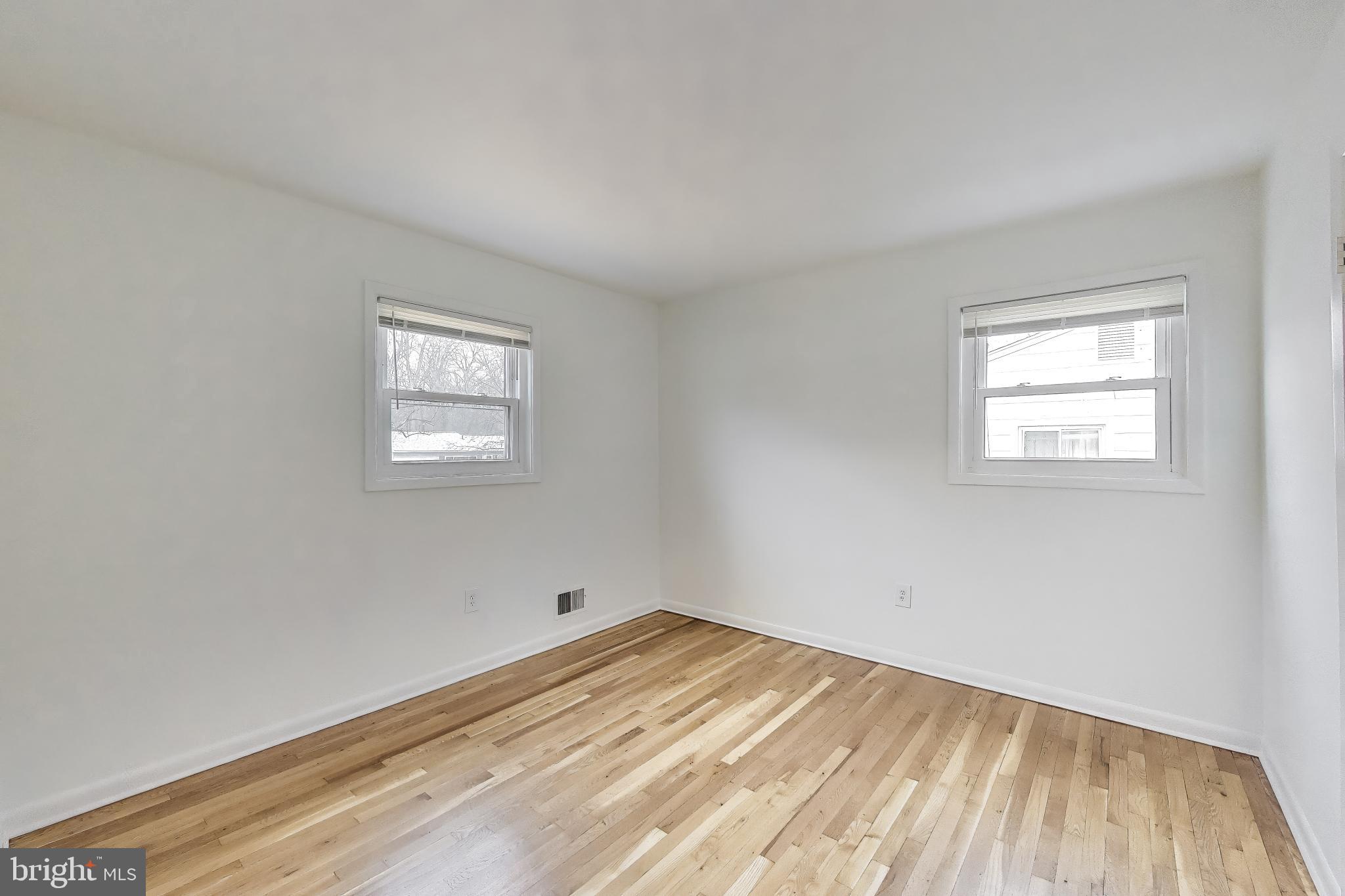 9233 Alcona Street Lanham, MD 20706 - Photo 19 of 43 an empty room with a window