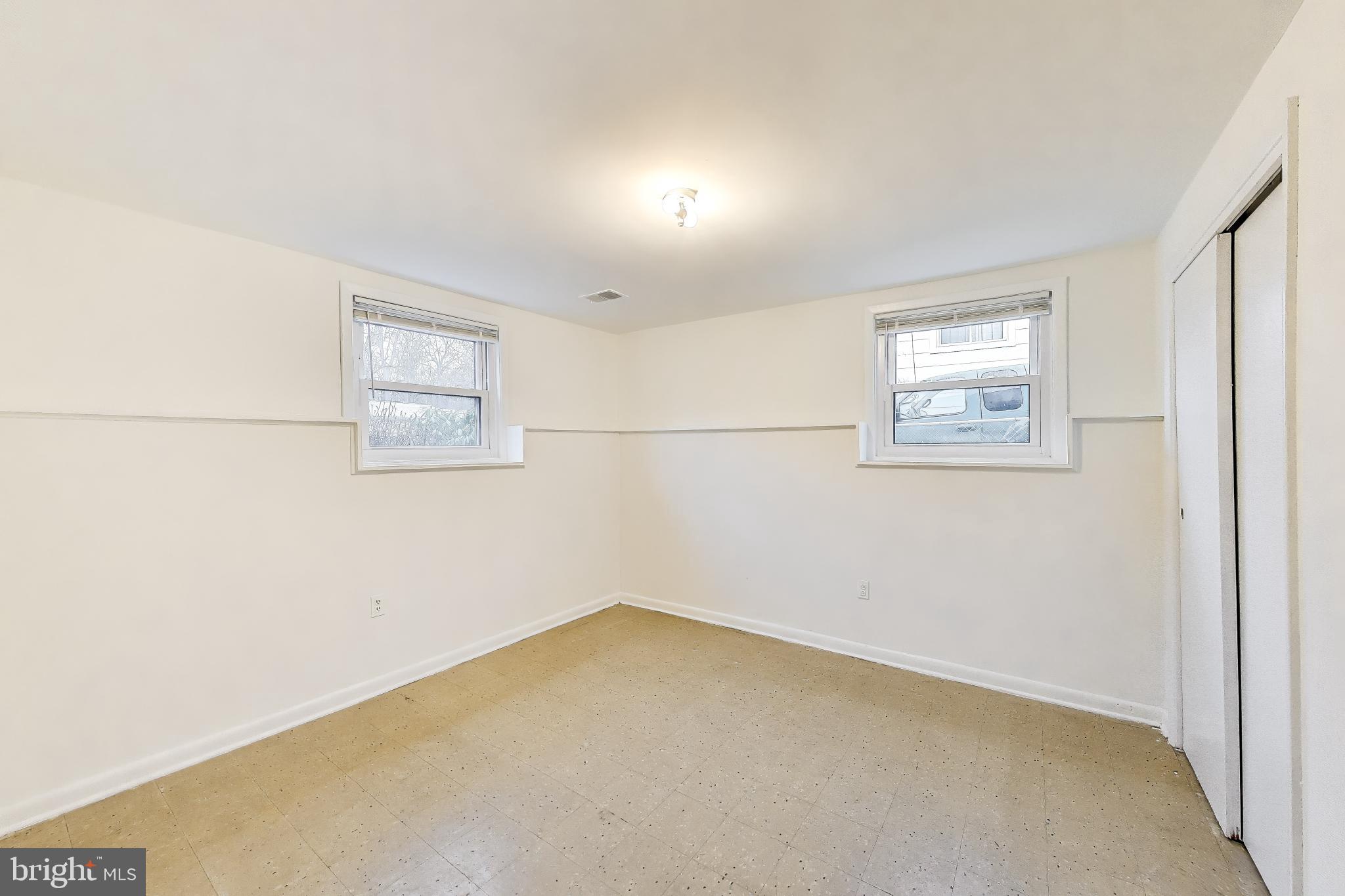 9233 Alcona Street Lanham, MD 20706 - Photo 32 of 43 an empty room with windows