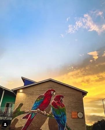 a front view of a house with a yard and an tree