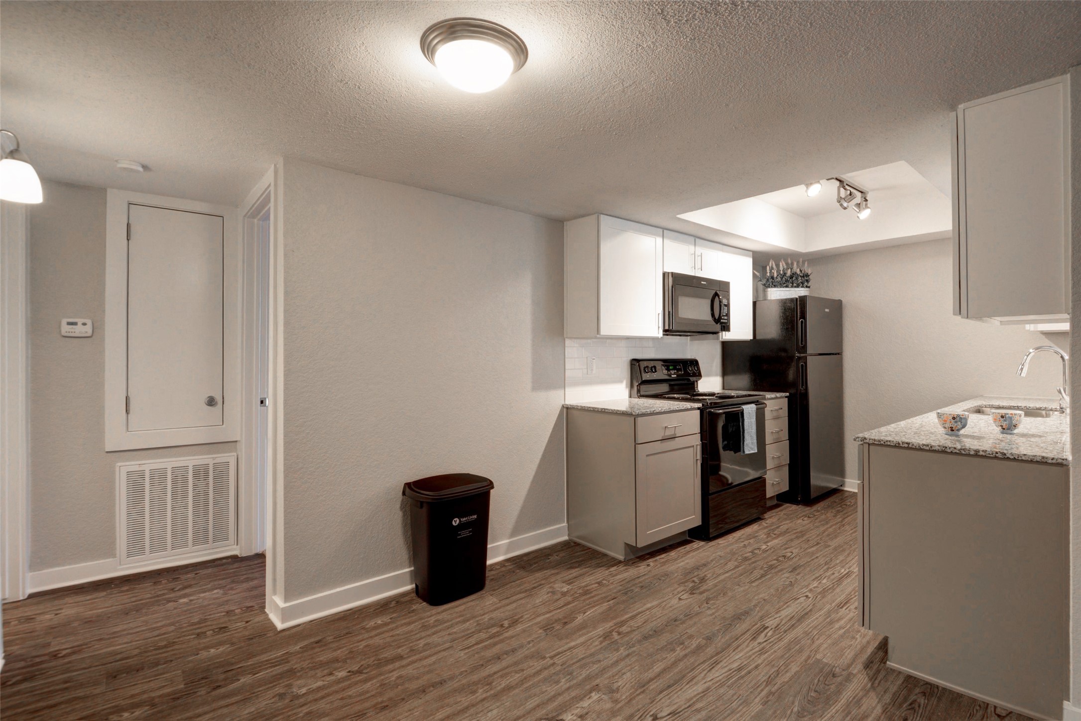 8787 Hammerly Boulevard, Unit 227 Houston, TX 77080 - Photo 2 of 40 a kitchen with a refrigerator and a stove top oven