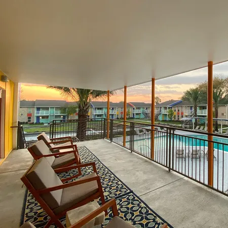 a backyard of a house with table and chairs
