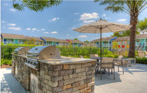 a view of swimming pool with outdoor seating