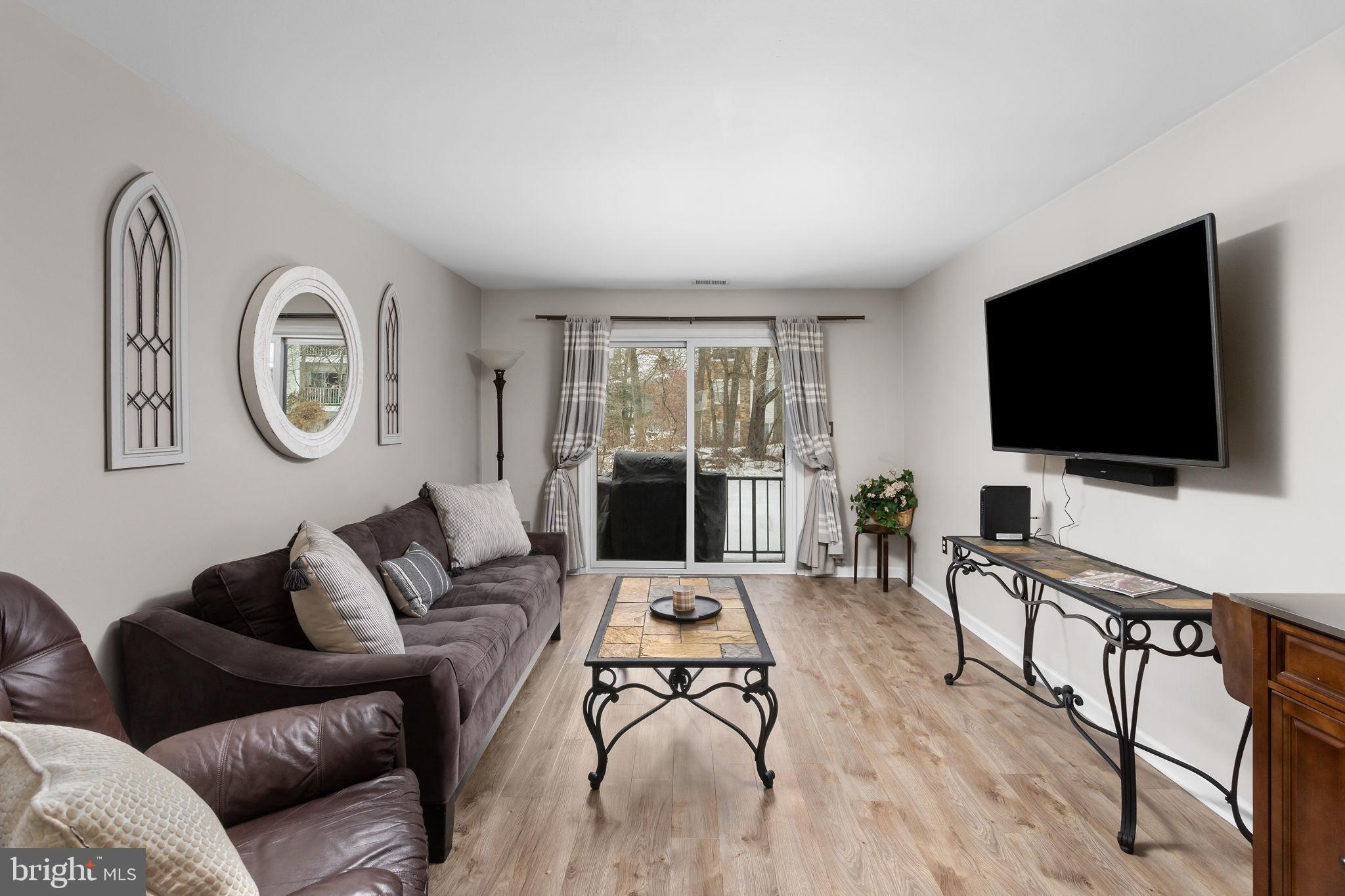 1306 Silver Court Hamilton, NJ 08690 - Photo 11 of 28 a living room with furniture and a flat screen tv