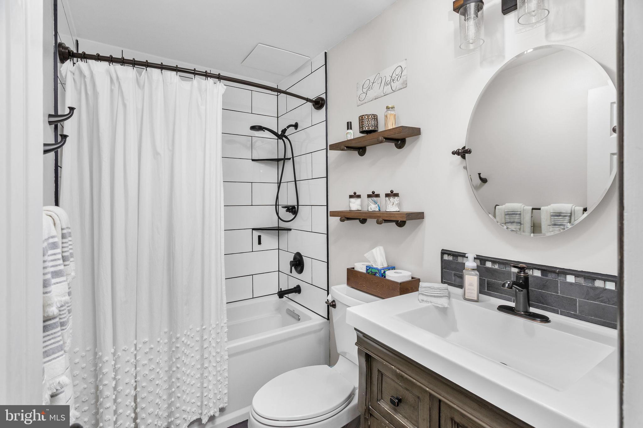 1306 Silver Court Hamilton, NJ 08690 - Photo 22 of 28 a bathroom with a sink toilet and shower
