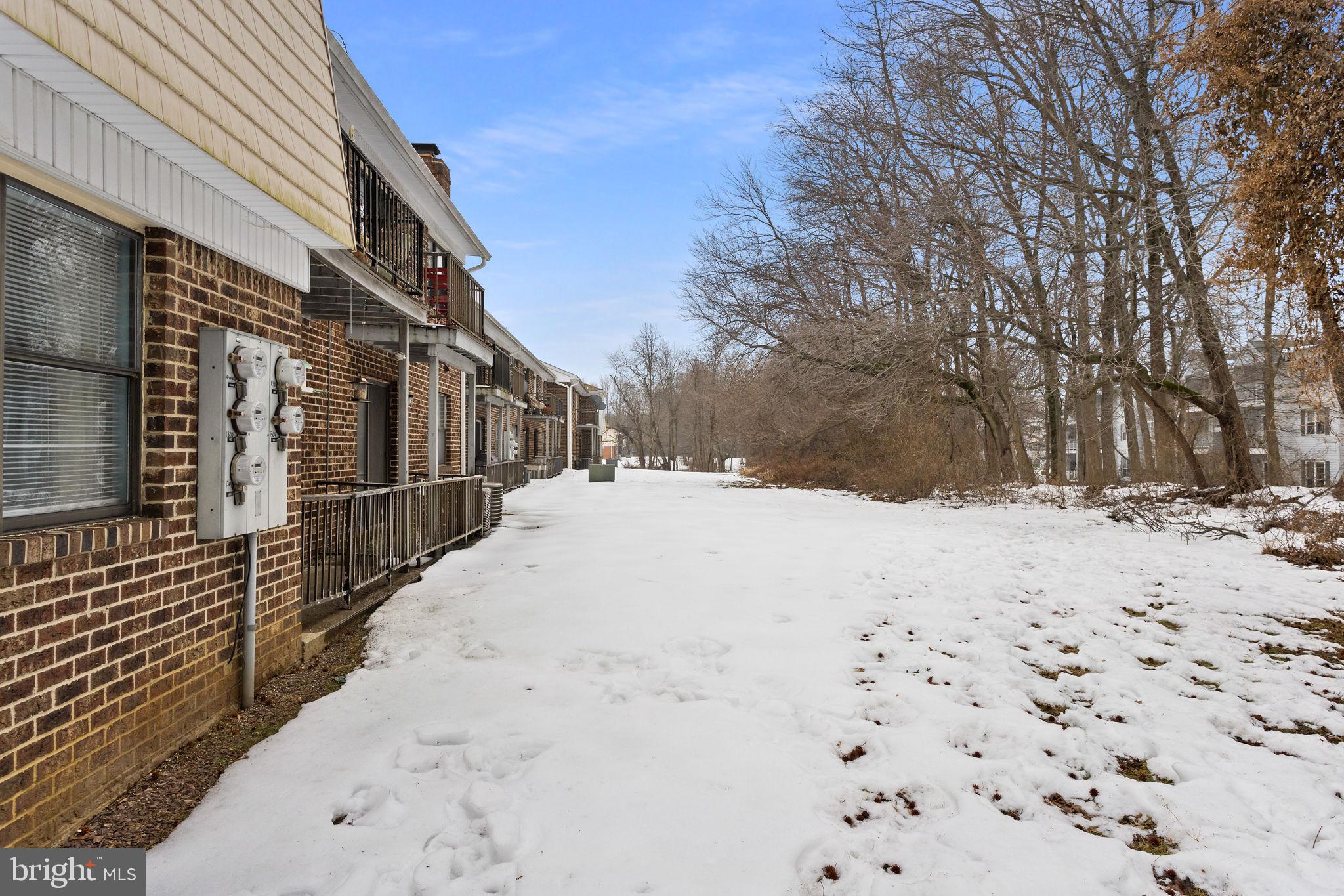 1306 Silver Court Hamilton, NJ 08690 - Photo 27 of 28 a view of white house with snow on the road