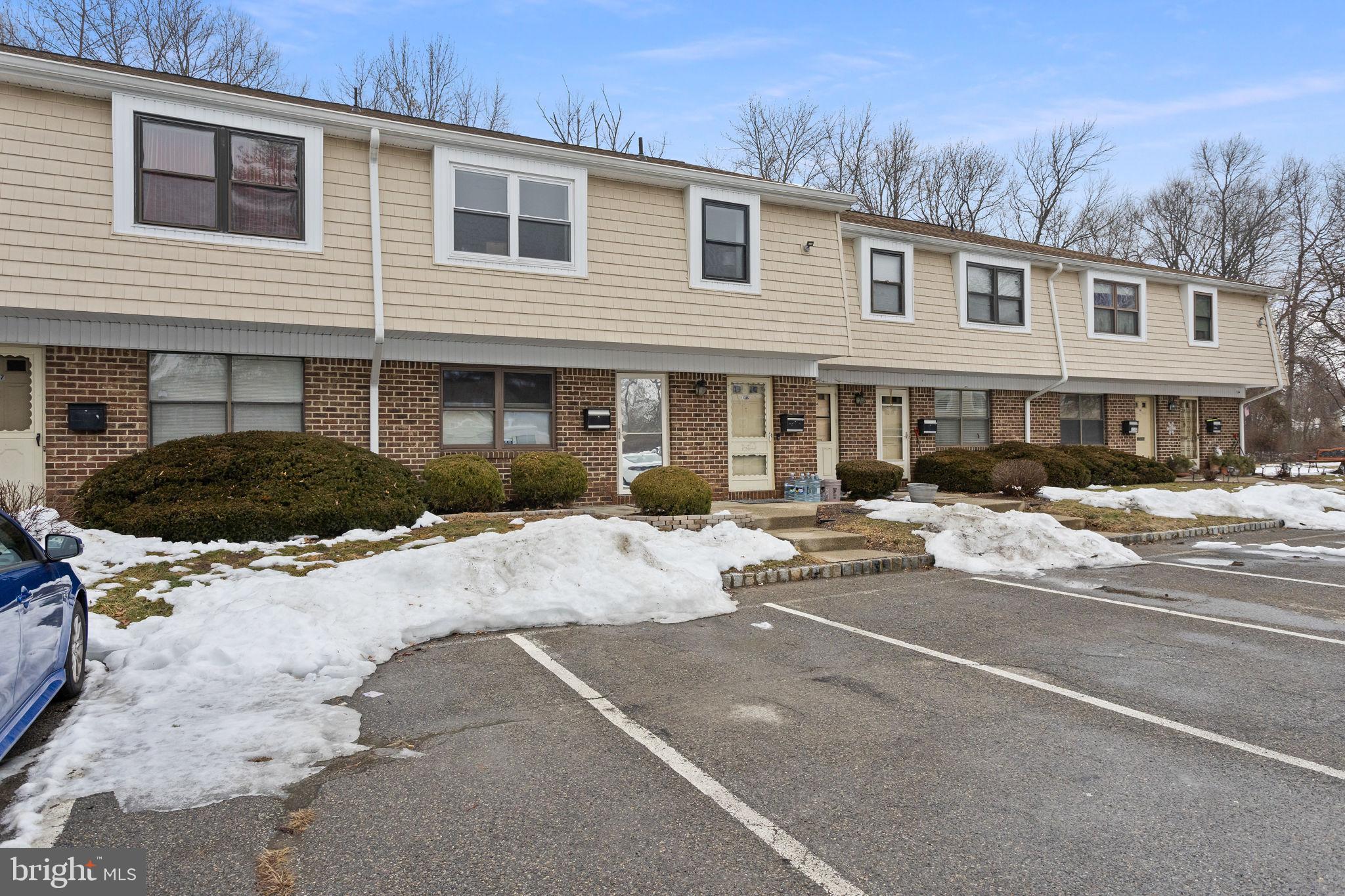 1306 Silver Court Hamilton, NJ 08690 - Photo 3 of 28 a front view of a house with cars parked