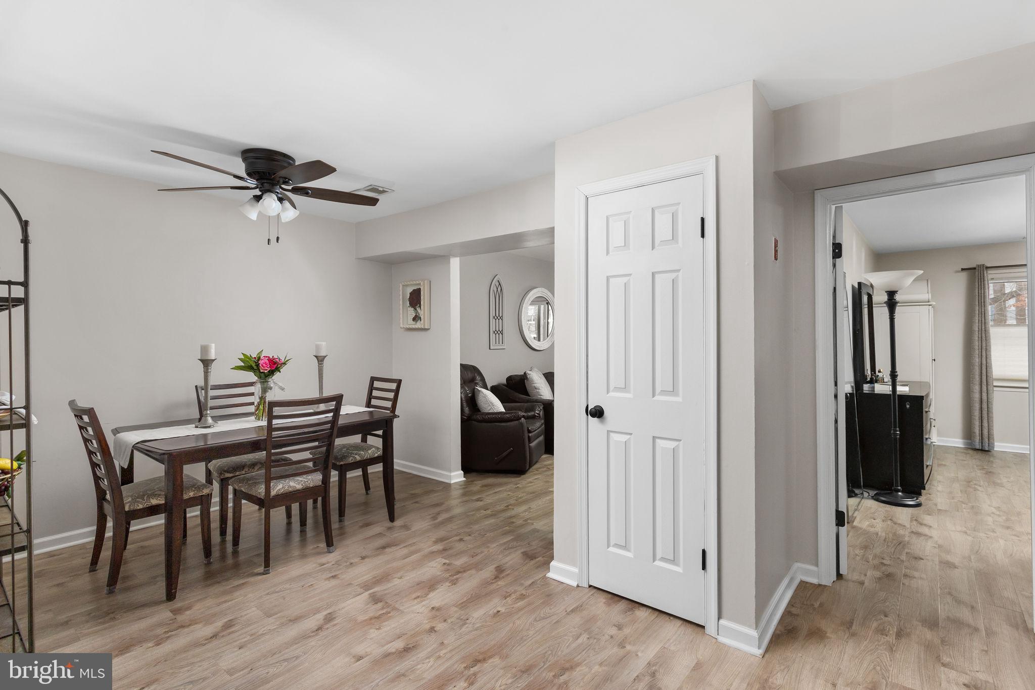 1306 Silver Court Hamilton, NJ 08690 - Photo 6 of 28 a view of a dining room with furniture and wooden floor