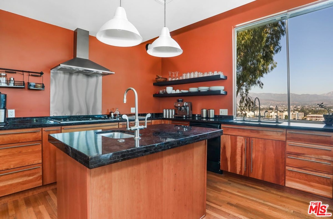 2730 Ivan Court Los Angeles, CA 90039 - Photo 13 of 38 a kitchen with stainless steel appliances granite countertop a sink dishwasher and a black countertop with white countertops
