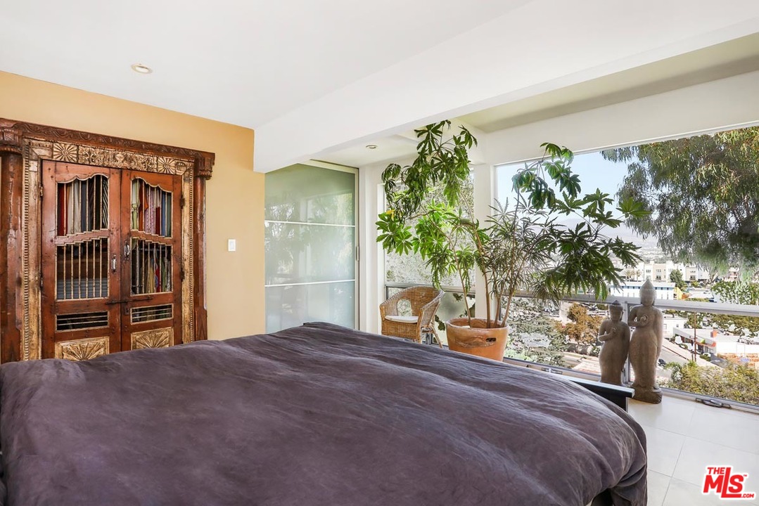 2730 Ivan Court Los Angeles, CA 90039 - Photo 18 of 38 a bedroom with a bed and a potted plant